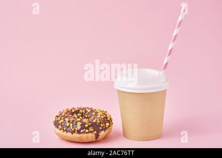 Cup of coffee and donut on pink background Stock Photo