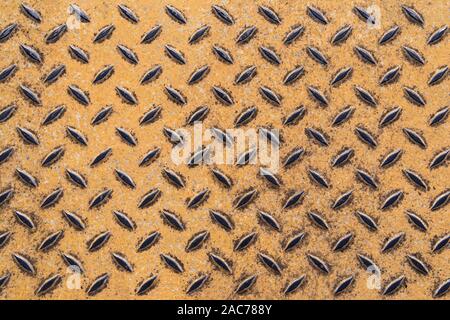 Industrial metal plate with yellow painted patterns Stock Photo