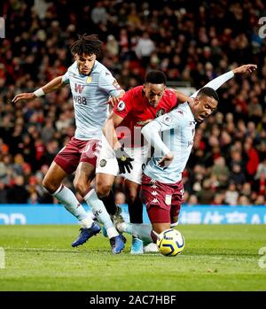 Aston Villa's Tyrone Mings (left) and Aston Villa's Jaden Philogene ...