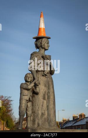 Statue of Jean Armour in Dumfries, Scotland,  with a traffic cone on her head. Stock Photo