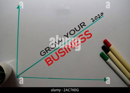 Grow Your Business 2020 write on white board background. Chart or mechanism concept Stock Photo