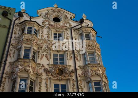 Helbling house in Innsbruck. This house presenting windows frames and a very decorated pediment - INNSBRUCK, Austria - October 26, 2019. Stock Photo