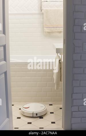robot vacuum cleaner in the bathroom Stock Photo - Alamy