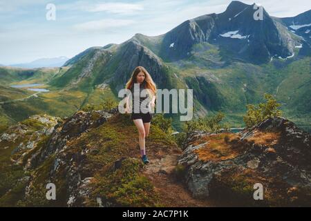 Woman trail running in mountains  outdoor mountains travel healthy lifestyle adventure activity athletic training motivation concept Norway nature Sen Stock Photo