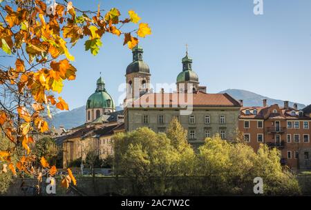 NNSBRUCK, AUSTRIA - October 26, 2019: View of the old palaces with the San Giacomo Cathedral towers on the Inn river bank - Innsbruck, Tyrol Austria Stock Photo