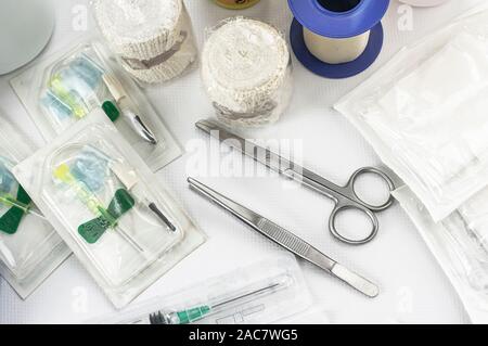 Basic kit for medical assistance in an emergency or emergency, with vials, scissors and tweezers, gauze, compressor, syringe, adhesive tape and disinf Stock Photo