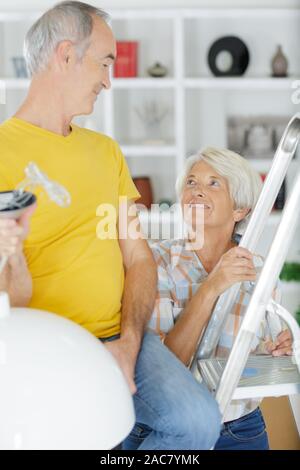 a senior couple doing diy Stock Photo