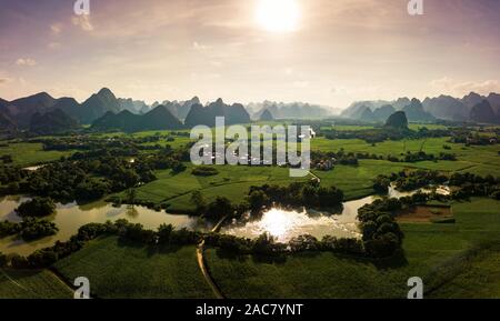 Karst landscape and agricultural fields in Guangxi province at south China aerial view at sunset Stock Photo