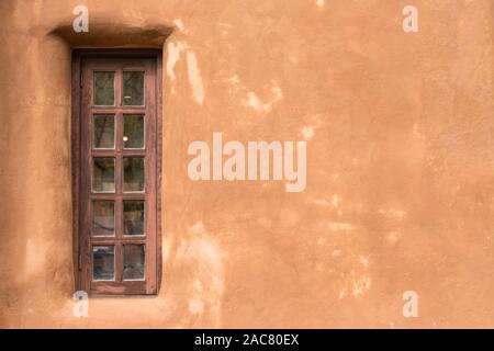 Old Southwestern Brown Adobe Wall and Window Stock Photo