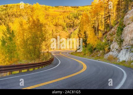 Winding autumn road through the San Juan Mountains of Colorado Stock Photo