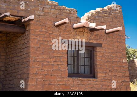 Windows and vigas in southwestern Stone building Stock Photo