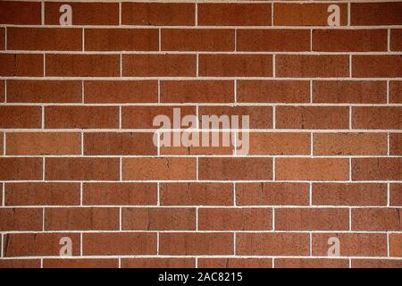 reddish brown brick wall background with slight concave curve Stock Photo