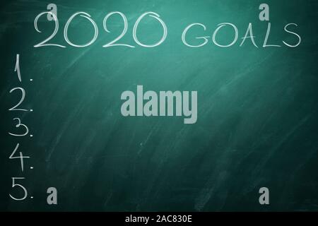 2020 Goals on green board. Chalkboard. Stock Photo