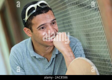 a man playing a paddle tennis match Stock Photo
