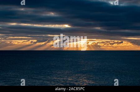 Sunrays before sunset on the south coast of England. Stock Photo