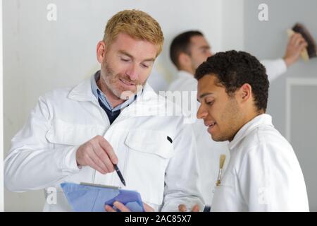 young apprentice painter in professional training Stock Photo