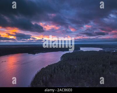 Lake with islands and a purple sunset, aerial panorama Stock Photo