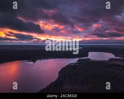 Lake with islands and a purple sunset, aerial panorama Stock Photo