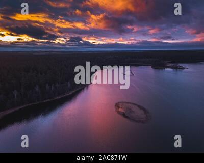 Lake with islands and a purple sunset, aerial panorama Stock Photo