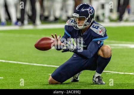 Tennessee Titans punter Brett Kern #6 is thrown for a loss while attempting  a fake punt during an NFL football game between the Tampa Bay Buccaneers  and the Tennessee Titans, Sunday, Oct.