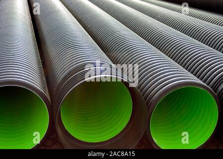 Corrugated water pipes of large diameter prepared for laying. Stock Photo