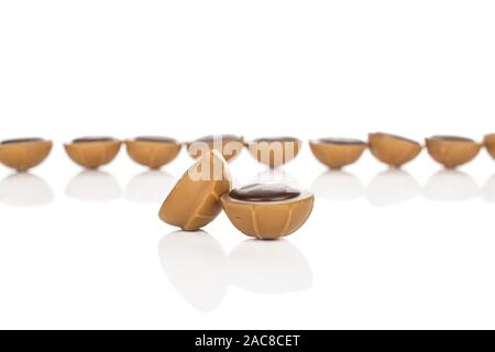 Lot of whole sweet brown toffee two in focus isolated on white background Stock Photo