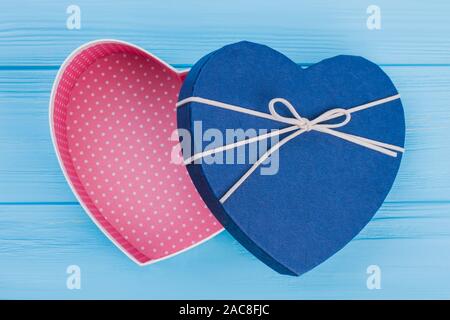 Opened blue heart shaped gift box. Stock Photo