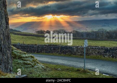 Settle sunset at Winskill Stones near Langcliffe in the Yorkshire Dales. Stock Photo