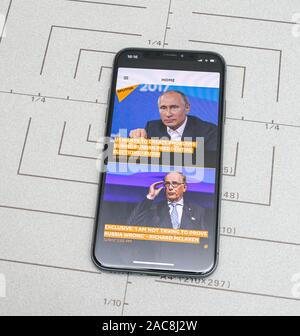 Paris, France - Nov 11, 2017: Latest Apple Computers iPhone 11 Pro featuring Sputnik News app with Vladimir Putin Russian President and Richard McLaren Stock Photo