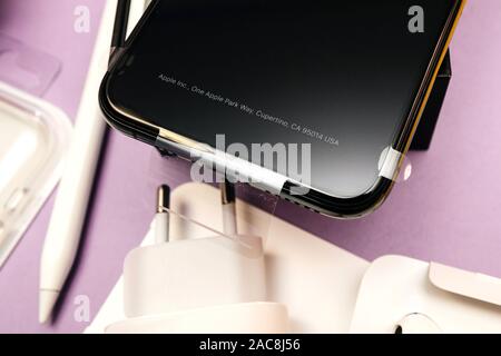 Paris, France - Sep 20, 2019: View from above of the plastic film protection on the display of latest iPhone 11 Pro by Apple Computers after unboxing with address in Cupertino Stock Photo