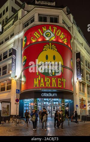 Paris, France - December 1, 2019: Cidadium shopping mall with Chinatown market billboard on boulevard haussmann Stock Photo