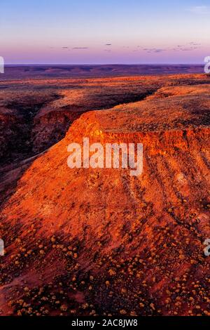 Sunset in the Australian outback. This aerial image shows the remote George Gill Range in central Australia from a helicopter. Stock Photo