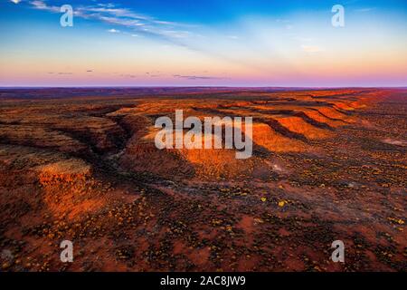 Sunset in the Australian outback. This aerial image shows the remote George Gill Range in central Australia from a helicopter. Stock Photo