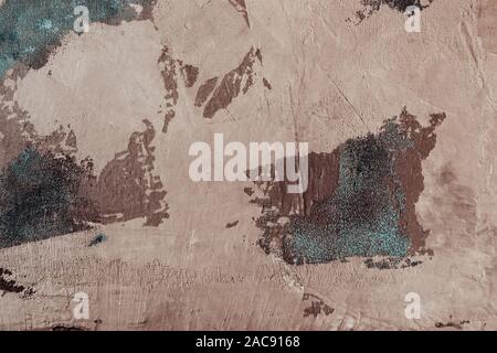 Beige decorative stucco with blue fabric mesh. Aged atmospheric texture or background. Stock Photo