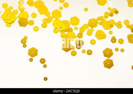 Festive shining background with golden hexagonal sparkles. Holiday concept, copy space. Stock Photo