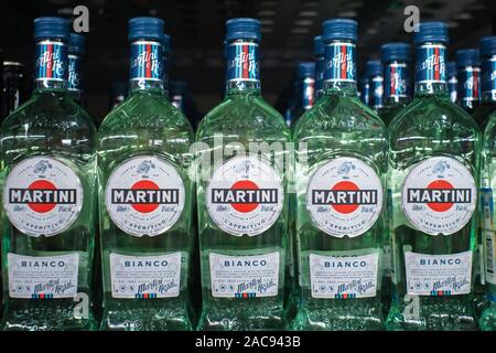 Tyumen, Russia-November 05, 2019: Bottles of various types of Martini Bianco Vermouth on store shelves for sale in Hypermarket. Martini is a brand of Stock Photo