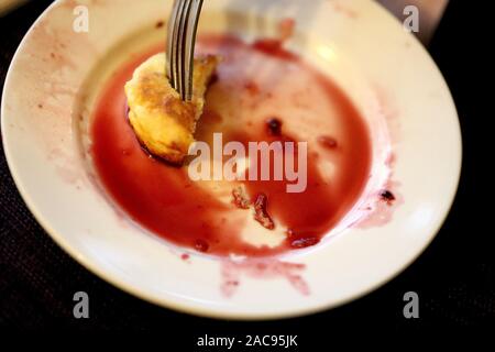 Photo background macro cheesecake on a plate with jam Stock Photo