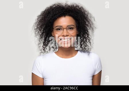 Head shot portrait smiling African American woman wearing glasses Stock Photo