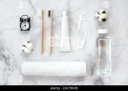 Set of eco-friendly toothbrushes, toothpaste and other tools on marble background. Dental and healthcare concept. Top view, flat lay. Stock Photo