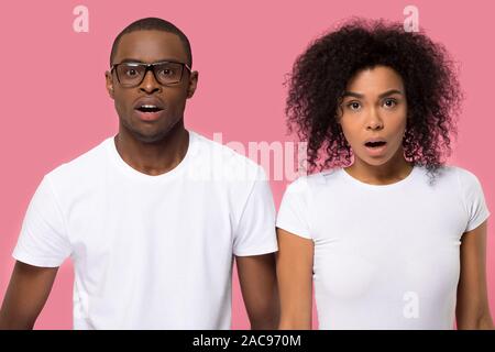 Amazed surprised young African American couple with open mouth Stock Photo