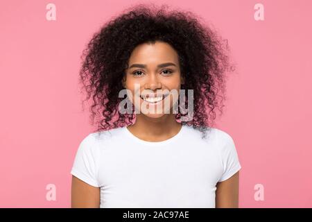 Head shot portrait smiling African American woman looking at camera Stock Photo