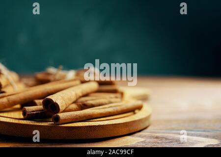 Cinnamon sticks. On old wooden table cinnamon sticks. Stock Photo