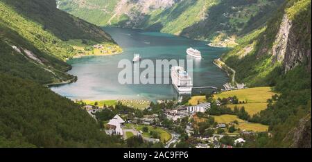 Geirangerfjord, Norway. Aerial View Of Geiranger In Geirangerfjorden In Summer Day. Touristic Ship Ferry Boat Liner Moored Near Geiranger. Famous Norw Stock Photo