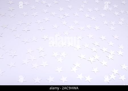 Holiday background with little silver stars. Festive holiday backdrop. Stock Photo