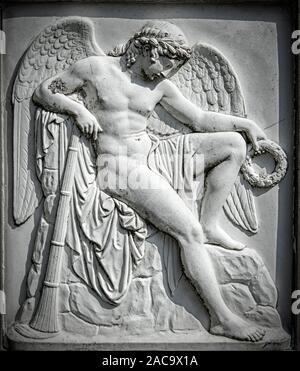 KARLSHAMN, SWEDEN - AUGUST 24, 2019: An angel relief on a headstone at the church graveyard. Stock Photo