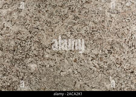Beige and brown natural granite stone texture close-up. Stock Photo