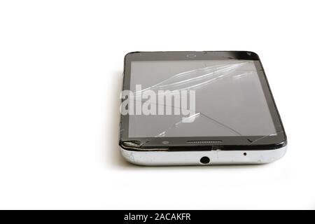 Old phone with broken screen isolated on white background Stock Photo