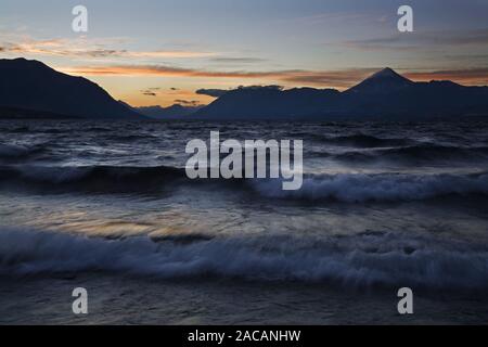 Surf at Lake Lago Huechulafquen with Volcano Lanin at sunset, Argentina, Lake Lago Huechulafquen with Vulcan Lanin at sundown Stock Photo