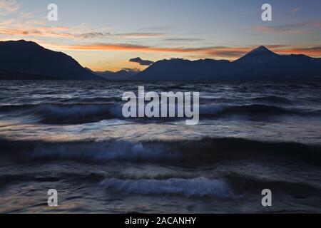 Surf at Lake Lago Huechulafquen with Volcano Lanin at sunset, Argentina, Lake Lago Huechulafquen with Vulcan Lanin at sundown Stock Photo