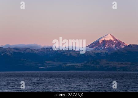 Lake Lago Huechulafquen with the volcano Lanin at sunrise, Argentina, Lake Lago Huechulafquen with Vulcan Lanin at sunrise Stock Photo